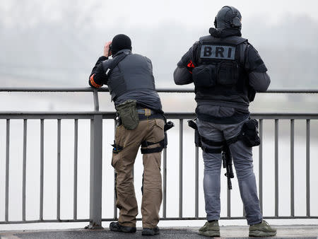 Members of French special police forces of Research and Intervention Brigade (BRI) patrol at the French-German border the day after a shooting in Strasbourg, France, December 12, 2018. REUTERS/Vincent Kessler