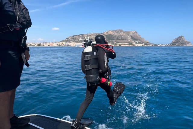 <p>ITALIAN COAST GUARD HANDOUT/EPA-EFE/Shutterstock </p> Rescue personnel conducting dicing inspections of the 'Bayesian' yacht's wreck