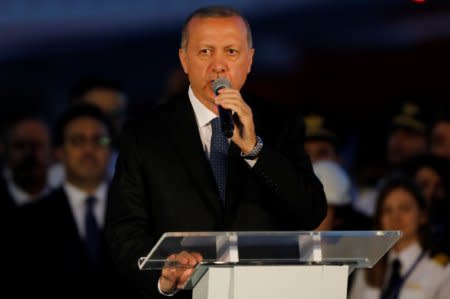 Turkey's President Tayyip Erdogan addresses the audience at Istanbul's third international airport which is still under construction during a ceremony marking the first landing, Turkey, June 21, 2018. REUTERS/Umit Bektas