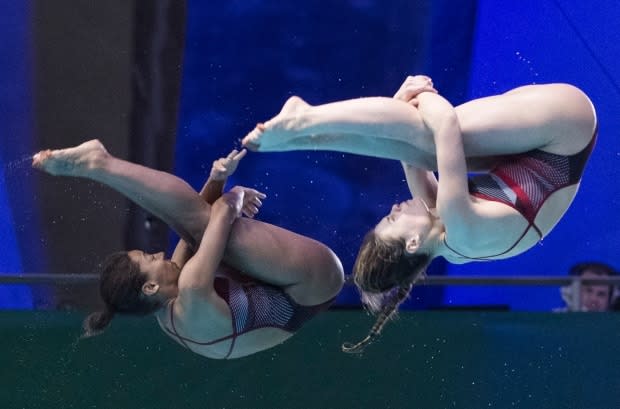 Canada's Jennifer Abel, left, and Melissa Citrini-Beaulieu won silver in women's 3-metre synchro at a diving World Cup event in Tokyo on Saturday.  (Graham Hughes/Canadian Press/File - image credit)