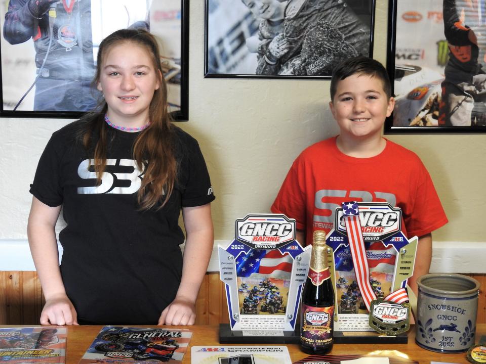 Raelynn and Bryson Dickerson of Warsaw with various awards from the past season of racing in the Grand National Cross Country national competition for ATVs. Bryson placed second in the micro division and first in the youth division for the past season. Raelynn was 11th.