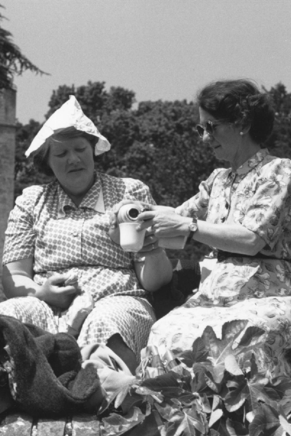 Two women enjoying a picnic for the Queen's coronation