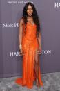 <p>Naomi loves Versace. Unfortunately, we haven’t fallen for this sequinned orange number. <i>[Photo: Getty]</i> </p>