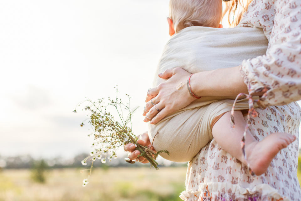 Mum and baby walking in nature. (Getty Images)