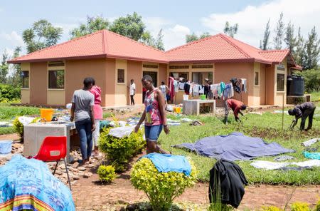 Residents wash their laundry at the Agahozo-Shalom Youth Village (ASYV) built to rehabilitate children who lost their families in the 1994 Rwandan genocide, in Rwamagana, Eastern Province of Rwanda April 1, 2019. Picture taken April 1, 2019. REUTERS/Jean Bizimana