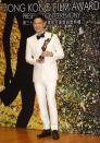 Hong Kong actor Nick Cheung Ka-fai poses after winning the Best Actor award for his movie “Unbeatable” at the 33rd Hong Kong Film Awards in Hong Kong Sunday, April 13, 2014. (AP Photo/Kin Cheung)