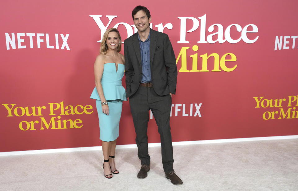 Reese Witherspoon, left, and Ashton Kutcher arrive at the world premiere of "Your Place Or Mine," Thursday, Feb. 2, 2023, at Regency Village Theatre in Los Angeles. (Photo by Jordan Strauss/Invision/AP)