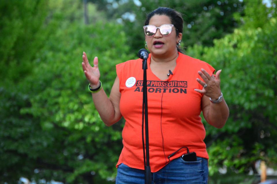 Chimene Schwach demands prosecutors and legislators go on record saying they will not prosecute abortions during remarks Saturday at an abortion rights rally outside the Boone County Courthouse.
