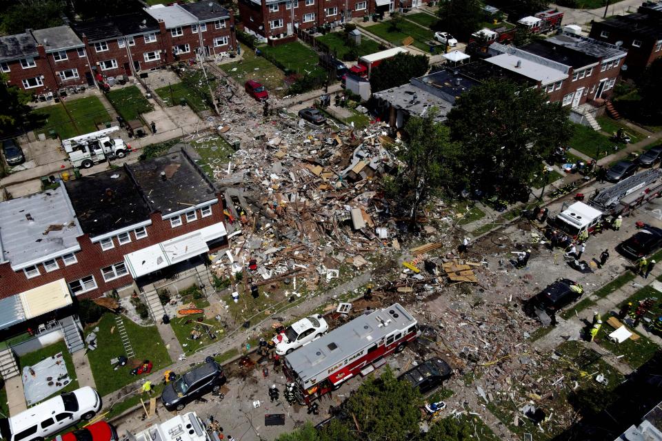 Debris and rubble cover the ground in the aftermath of an explosion in Baltimore on Monday, Aug. 10, 2020. Baltimore firefighters say an explosion has leveled several homes in the city.