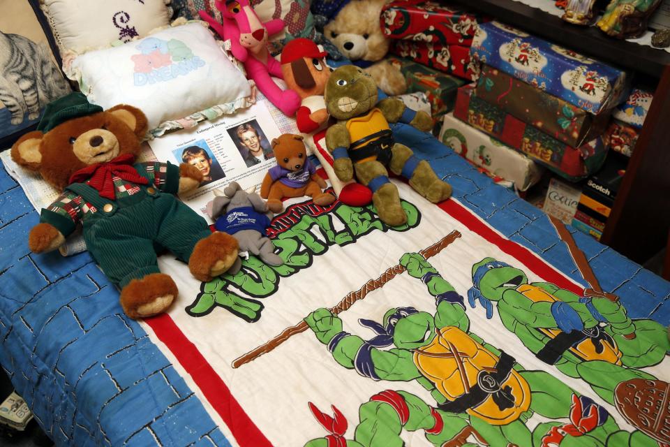 This photo taken April 29, 2014 shows the bedroom of Victor Shoemaker Jr., as it remains basically unchanged including stuffed animals on the bed and Christmas presents still wrapped, in Leesburg, Va. Twenty years after Victor Dwight Shoemaker Jr., vanished while playing with two cousins along a West Virginia mountainside, his parents hold the belief that their only child is still alive. The boy known as J.R. had been in the woods behind his grandfather's mobile home in Hampshire County when two cousins emerged without him on May 1, 1994. No trace of him was ever found. (AP Photo/Alex Brandon)