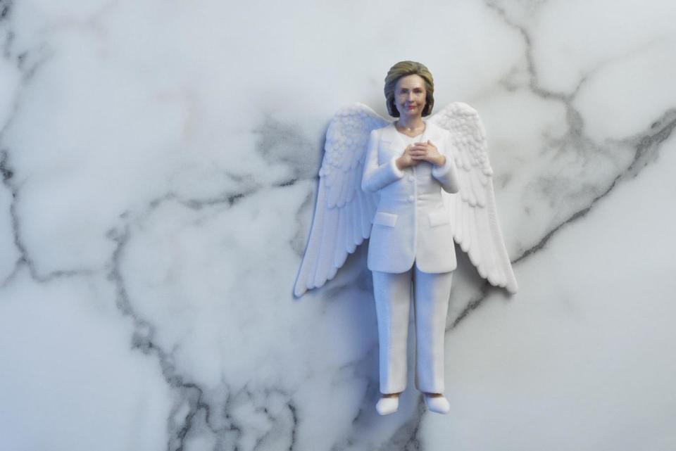 Former US presidential candidate, Hillary Clinton, dons a white power suit and angelic wings