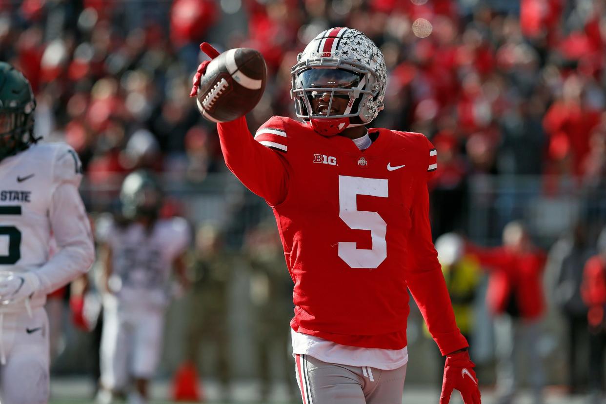 Ohio State Buckeyes wide receiver Garrett Wilson (5) celebrates a touchdown catch against Michigan State Spartans in the second quarter during their NCAA College football game at Ohio Stadium in Columbus, Ohio on November 20, 2021. 