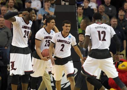 Quentin Snider celebrates with his Louisville teammates after their win over UC Irvine. (USAT)