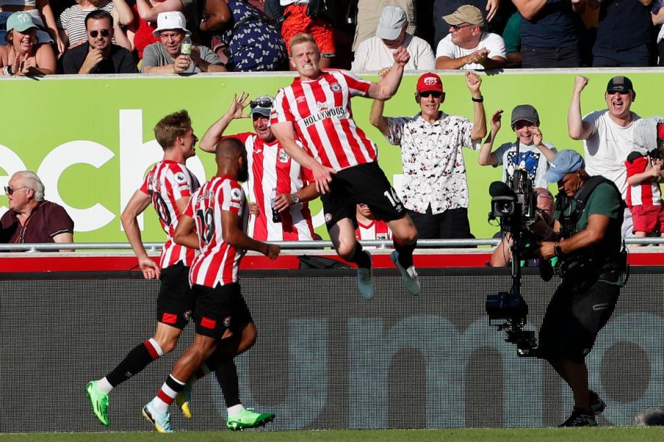 Mee celebrates Brentford’s third (AFP via Getty Images)