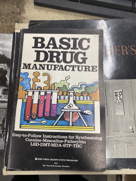 Cover of "Basic Drug Manufacture" by The Fantastic Venomous Consumption, featuring colorful lab equipment and a list of synthesized drugs