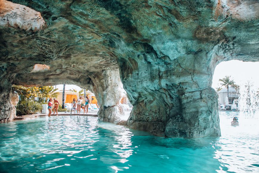 Formation, Cave, Water, Swimming pool, Sea cave, Rock, Coastal and oceanic landforms, Tourism, Vacation, Architecture, 