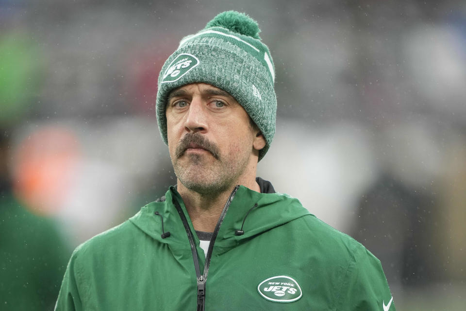 New York Jets quarterback Aaron Rodgers stands on the field before an NFL football game against the Atlanta Falcons on Sunday, Dec. 3, 2023, in East Rutherford, N.J. (AP Photo/Bryan Woolston)