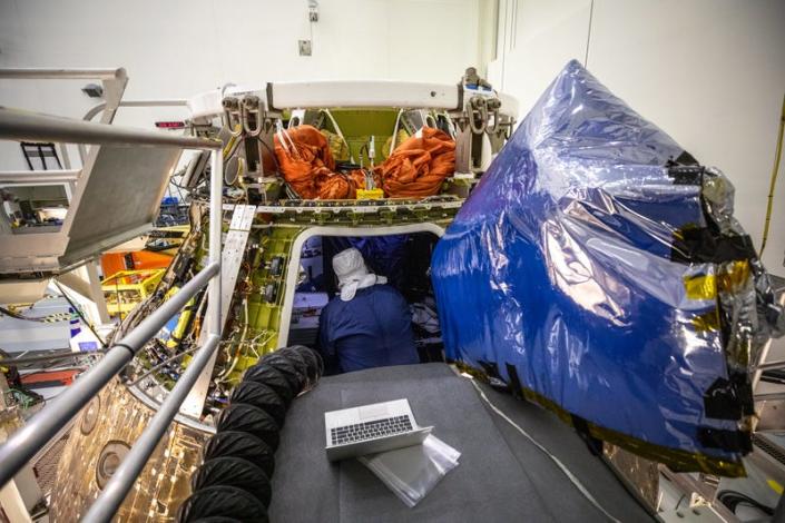 A technician unpacking Orion inside the Multi-Payload Processing Facility at Kennedy Space Center on January 6, 2023. 