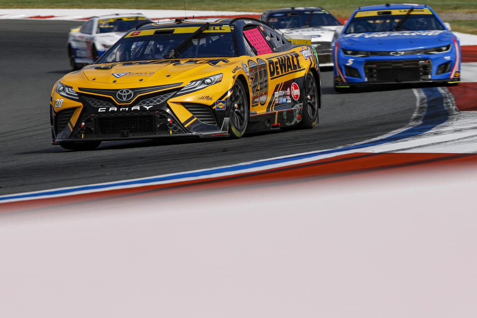 CONCORD, NORTH CAROLINA - OCTOBER 09: Christopher Bell, driver of the #20 DeWalt Toyota, leads the field during the NASCAR Cup Series Bank of America Roval 400 at Charlotte Motor Speedway on October 09, 2022 in Concord, North Carolina. (Photo by Jared C. Tilton/Getty Images)