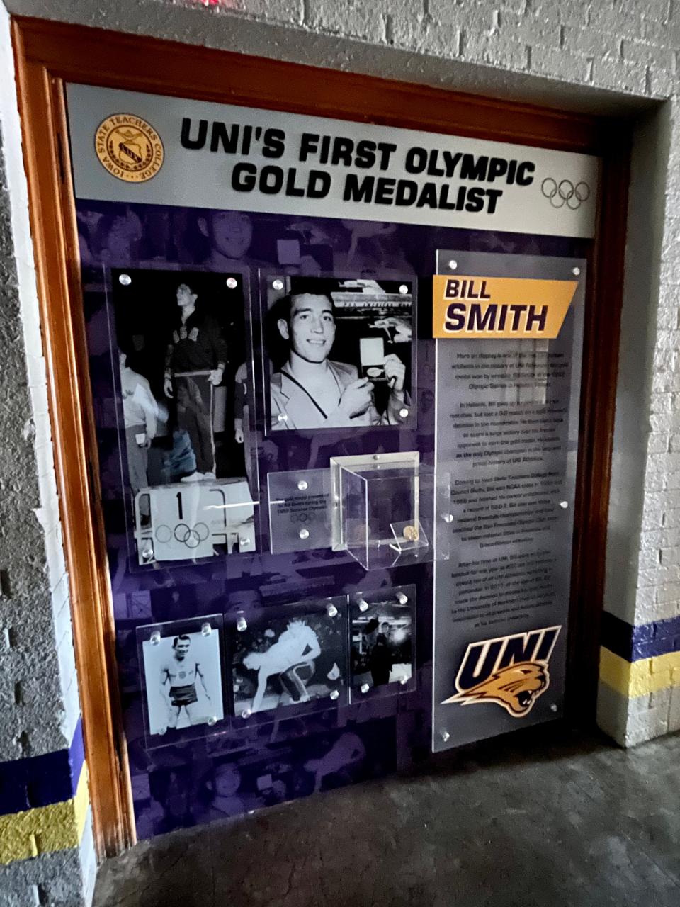 A picture inside Northern Iowa's historic West Gym commemorates Bill Smith, a former Northern Iowa wrestler who won gold at the 1952 Olympics in Helsinki.
