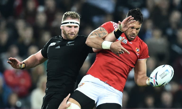 Tonga's lock Joseph Tuineau (R) and New Zealand's captain Kieran Read compete for the ball during their Rugby World Cup Pool C match, at St James' Park in Newcastle-upon-Tyne, on October 9, 2015
