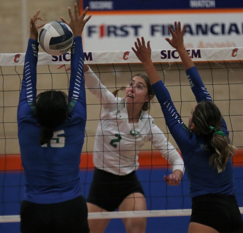 Wall High School's Kippy Pickens, 2, tries to squeeze a shot past an El Paso Montwood player during the Gold Division third-place match of the Nita Vannoy Memorial Volleyball Tournament at Babe Didrikson gym on Saturday, Aug. 20, 2022.