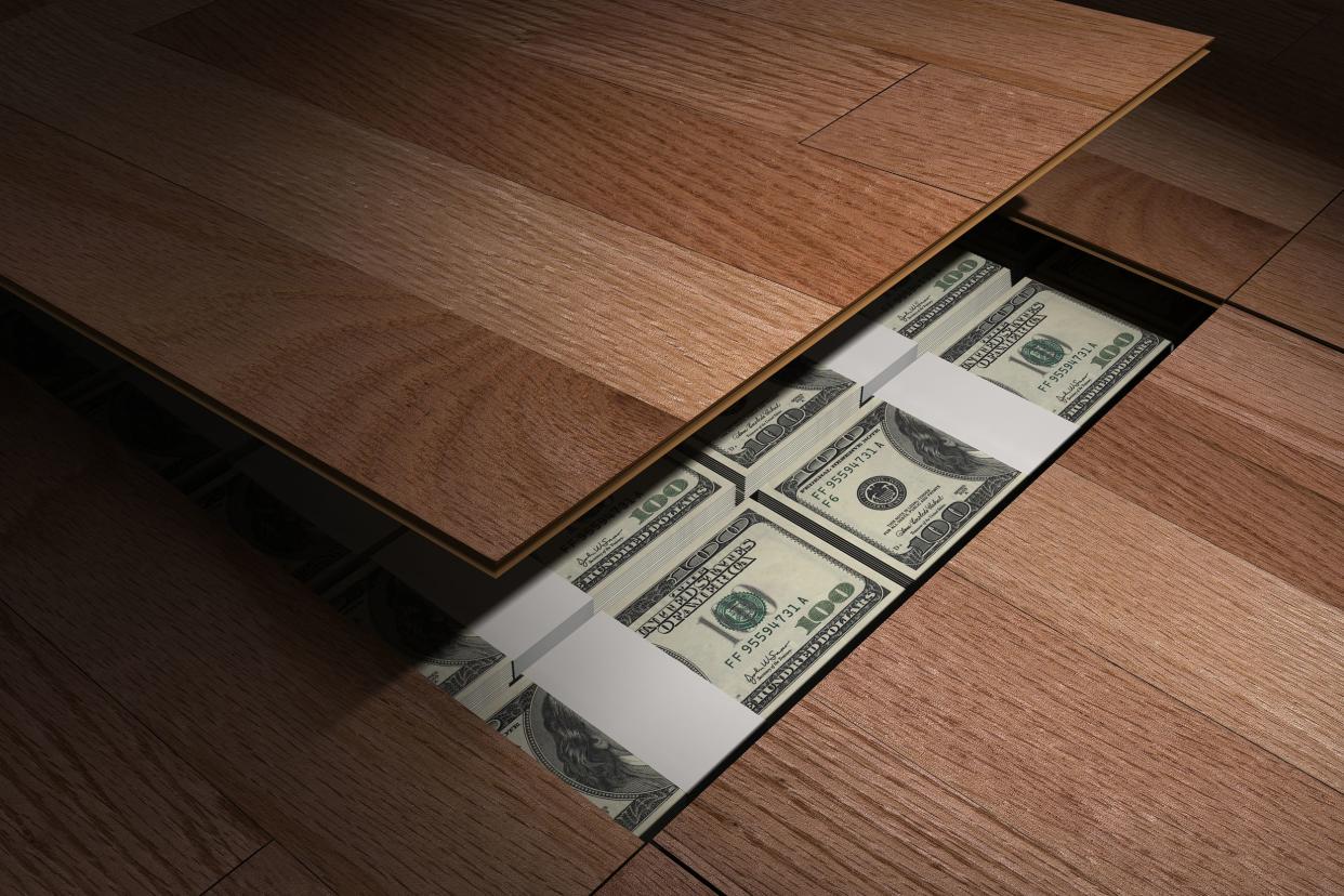 private stash of dollars hidden under the floor boards