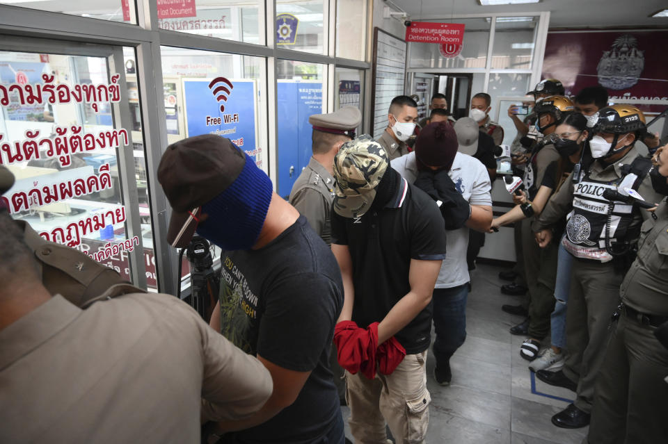 Four police officers with their face covers wanted in connection to the Thai murder of a drug dealing suspect at Nakhon Sawan station.