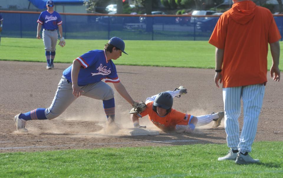 Highland's Hendrick Karya tries to tag Galion's Allen Carver.