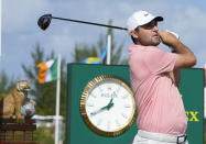 Scottie Scheffler, of the United States, watches his shot on the first tee during the final round of the Hero World Challenge PGA Tour at the Albany Golf Club in New Providence, Bahamas, Sunday, Dec. 4, 2022. (AP Photo/Fernando Llano)