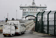 Cars are loaded onto a cross-channel ferry at the Port of Dunkerque, France, Friday Aug.14, 2020. British holiday makers in France were mulling whether to return home early Friday to avoid having to self-isolate for 14 days following the U.K. government's decision to reimpose quarantine restrictions on France amid a recent pick-up in coronavirus infections. (AP Photo/Olivier Matthys)