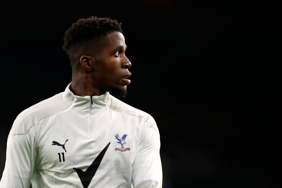 <p>Crystal Palace star Wilfried Zaha tested positive for coronavirus and missed the defeat at Burnley</p>Pool via REUTERS