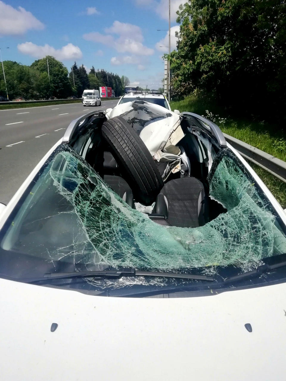 A driver has been called the "luckiest person in the world" after a tyre came off a lorry and crashed into his car on the M6 near Leyland. (SWNS)