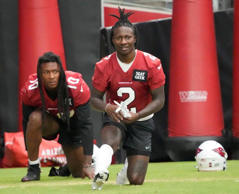 Aug 8, 2022; Glendale, Arizona, U.S.;  Arizona Cardinals wide receivers DeAndre Hopkins (10) and Marquise Brown (2) prepare for training camp at State Farm Stadium.