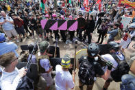 <p>Battle lines form between white nationalists, neo-Nazis and members of the “alt-right” and anti-fascist counter-protesters at the entrance to Lee Park during the “Unite the Right” rally Aug. 12, 2017 in Charlottesville, Va. (Photo: Chip Somodevilla/Getty Images) </p>