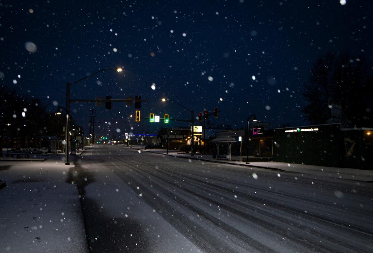 Snow falls on Willamette Street during a winter storm Saturday, Jan. 13, 2024, in Eugene, Ore.