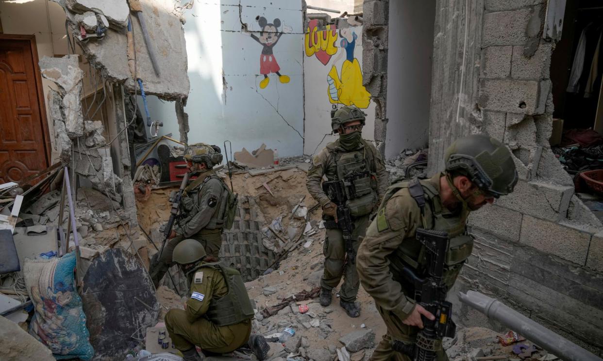 <span>Israeli soldiers at the entrance of a tunnel where the military says six Israeli hostages were recently killed by Hamas, in the Gaza Strip, 13 September 2024.</span><span>Photograph: Léo Corrêa/AP</span>