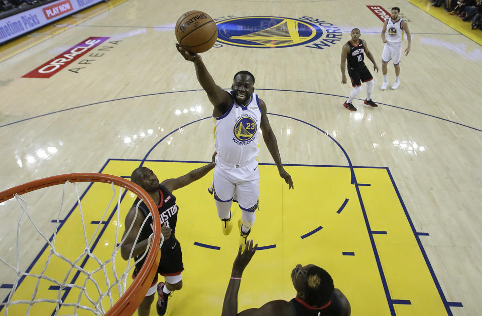 Golden State Warriors forward Draymond Green (23) shoots over Houston Rockets guard Chris Paul during the first half of Game 1 of a second-round NBA basketball playoff series in Oakland, Calif., Sunday, April 28, 2019. (AP Photo/Jeff Chiu, Pool)