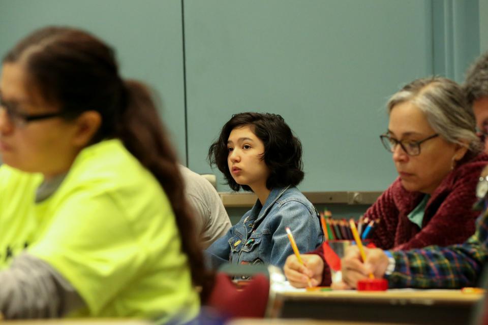 Mia Ozuna, 13, listens to manga illustrator Misako Rocks at the eighth Teen Bookfest By the Bay at American Bank Center Saturday, Feb. 4, 2023.