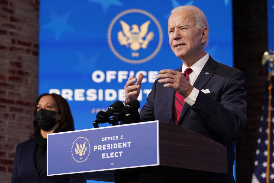 Vice President-elect Kamala Harris listens as President-elect Joe Biden speaks during an event at The Queen theater, Friday, Jan. 15, 2021, in Wilmington, Del. (AP Photo/Matt Slocum)