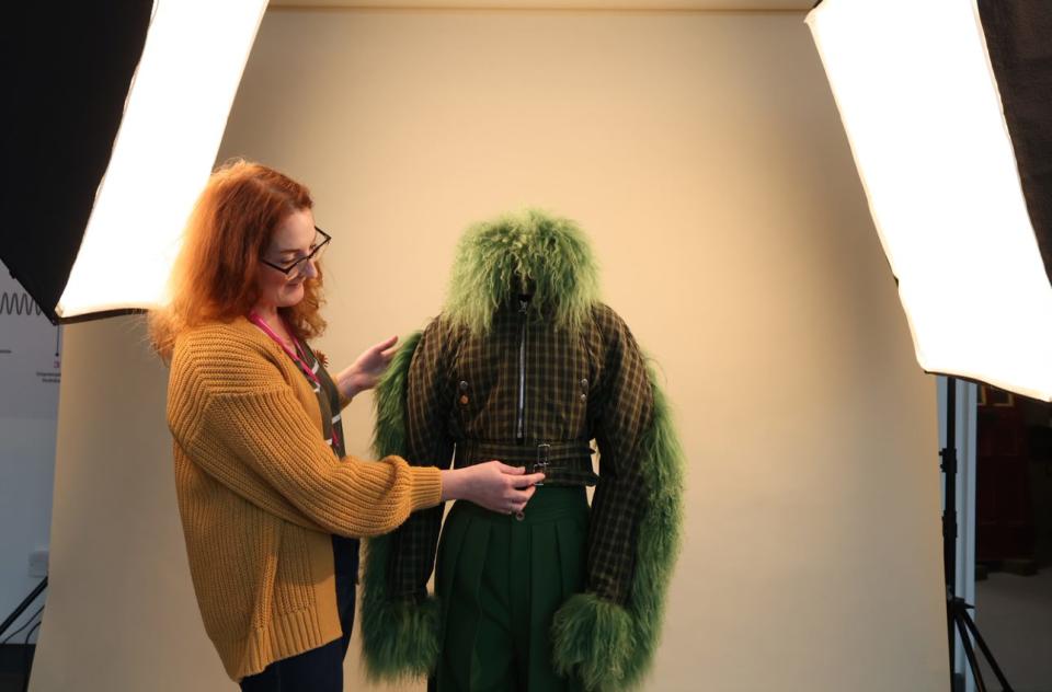 Curator Kay Jones makes final touches to a costume worn by actress Jodie Comer, as Villanelle in Killing Eve, which will go on display in the Museum of Liverpool's Wondrous Place gallery (Gareth Jones/PA)