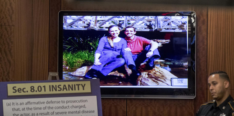 A photo of murder victims Katie and Stephen Stay is projected on a screen during closing arguments in Ronald Haskell's capital murder trial, Wednesday, Sept. 25, 2019, in Houston. Haskell is on trial for the 2014 shooting of six members of his ex-wife's family in suburban Houston. (Brett Coomer/Houston Chronicle via AP)