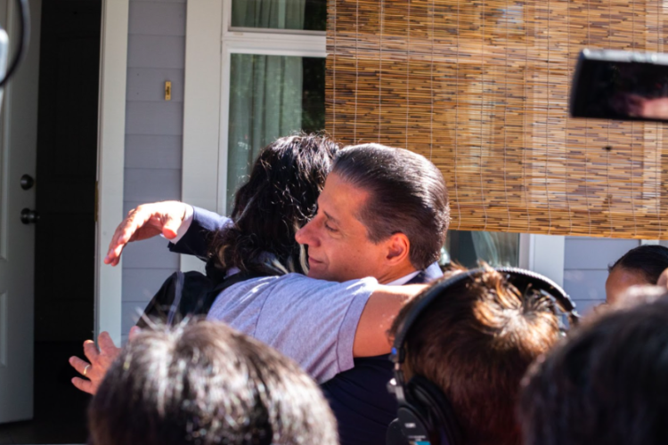Carvalho embracing Yordi Luna outside of his home