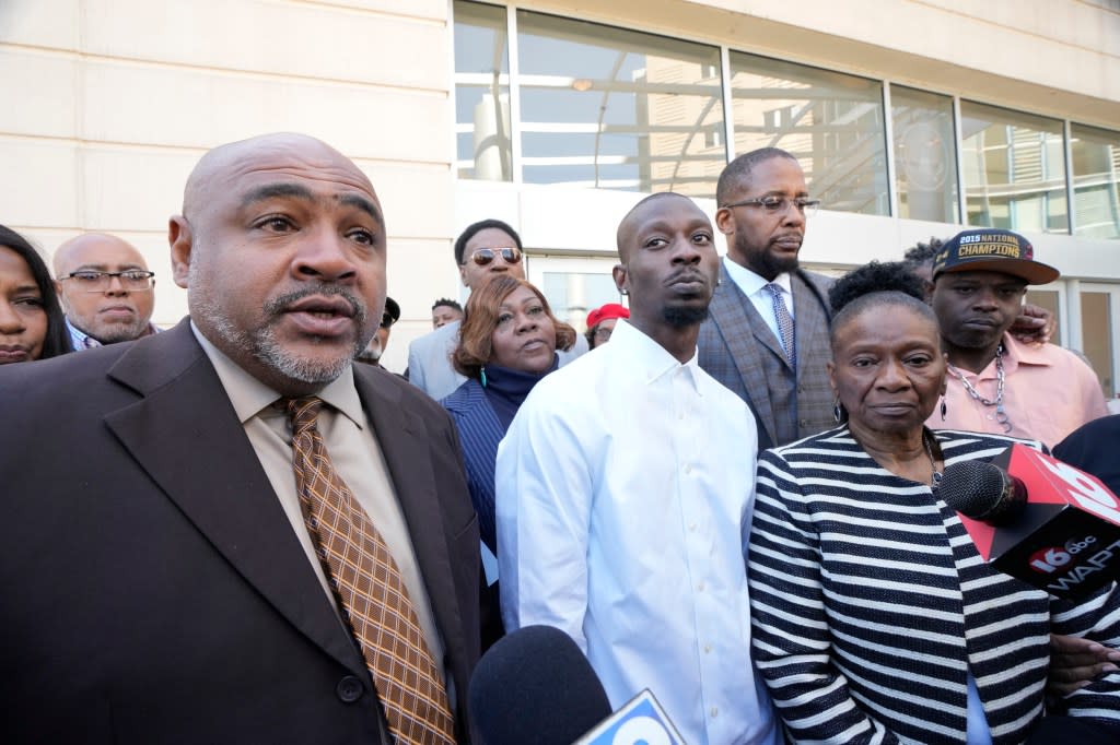 Co-counsel Trent Walker, left, speaks on the 20 years in prison former Mississippi Rankin County Sheriff’s Deputy Hunter Elward, unseen, received in federal court for his part in torturing Michael Corey Jenkins, center, and Eddie Terrell Parker, far right, Tuesday, March 19, 2024, in Jackson, Miss. Elward is one of six former Mississippi Rankin County law enforcement officers who committed numerous acts of racially motivated, violent torture on Jenkins and Parker. Sentencing started Tuesday since the men had earlier pleaded guilty to a number of charges. (AP Photo/Rogelio V. Solis)