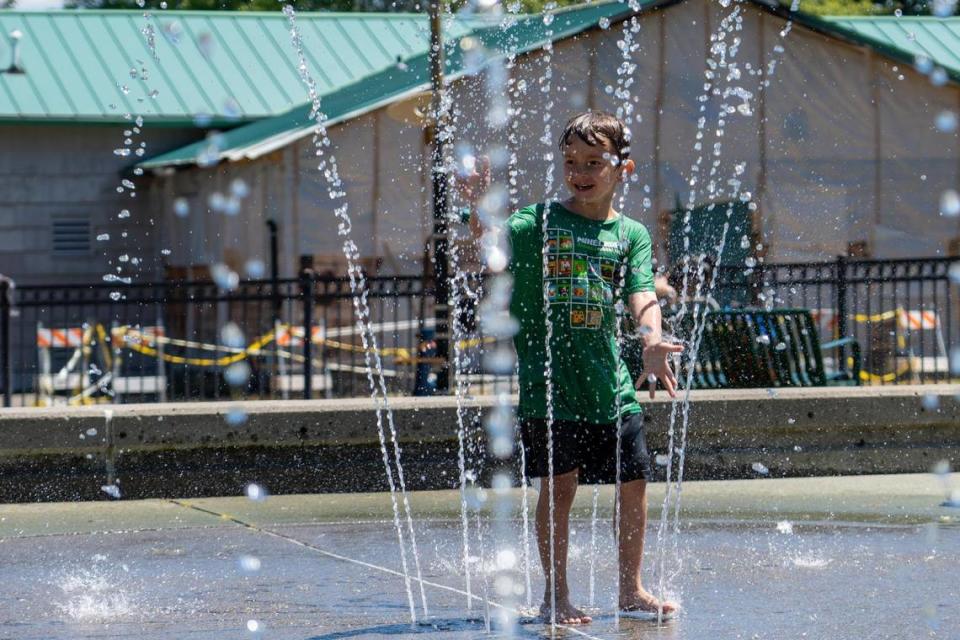 Teddy Williams, 6, plays in the splashground at Jefferson Park in Tacoma on Thursday June 23, 2022.