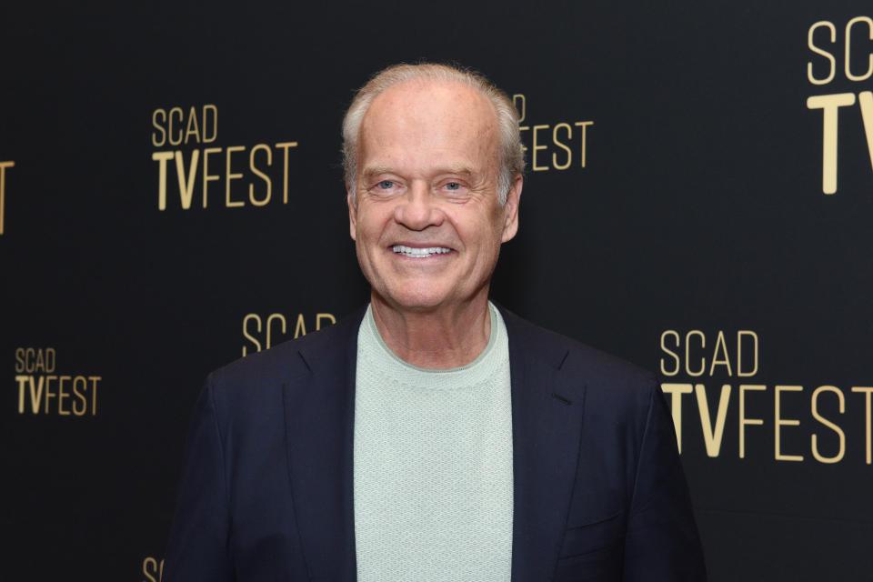 Kelsey Grammer smiling at SCAD TVfest event, wearing a casual sweater