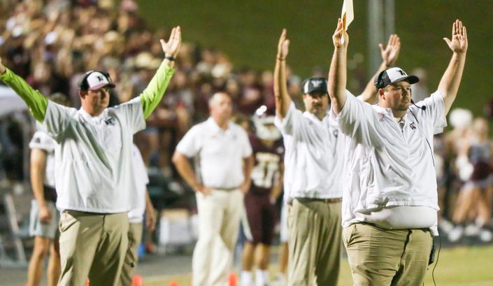 Niceville coaches try to get a touchdown called after Niceville was stopped just short of the goal line during the Niceville Crestview rivalry football game at Niceville.