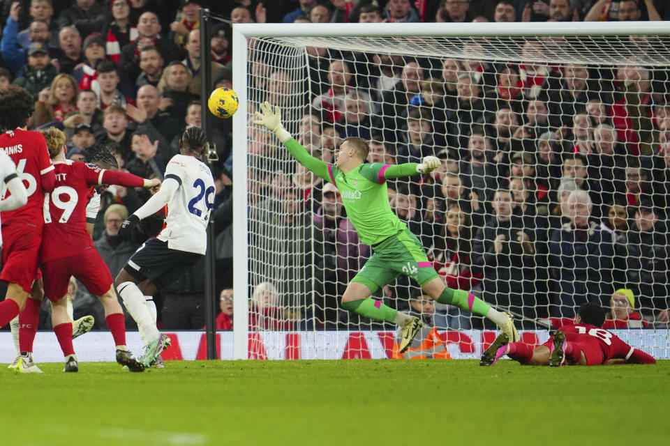 Liverpool's Harvey Elliott scores his side's fourth goal during the English Premier League soccer match between Liverpool and Luton Town, at Anfield stadium in Liverpool, England, Wednesday, Feb. 21, 2024. (AP Photo/Jon Super)