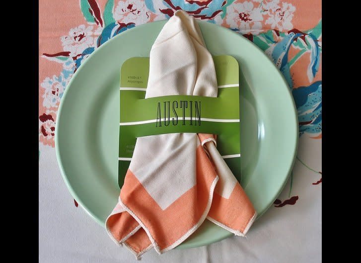 Turn an old paint chip into a colorful napkin ring like etsy artisan <a href="http://www.etsy.com/listing/85638298/paint-chip-style-place-cards-napkin?ref=sr_gallery_26&ga_search_submit=&ga_search_query=napkin+ring&ga_view_type=gallery&ga_ship_to=US&ga_search_type=handmade&ga_facet=handmade" target="_hplink">GrahamandOlive</a> did. Simply cut two parallel lines and pull your napkin through the opening.     Photo by GrahamandOlive