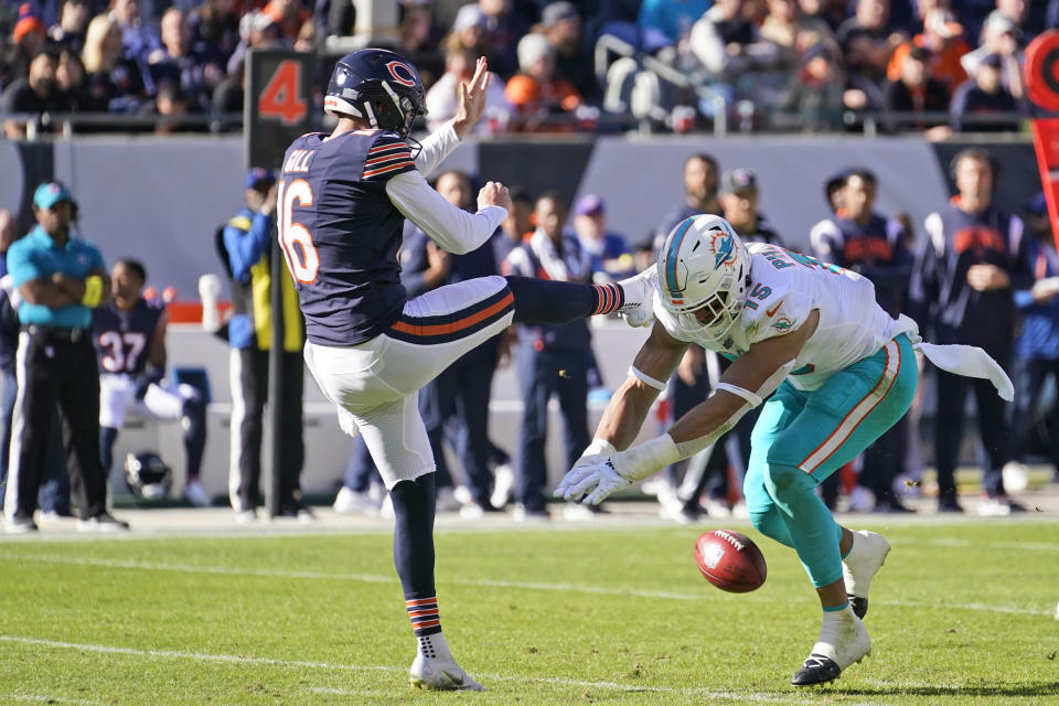 Miami Dolphins linebacker Jaelan Phillips, right, blocks a kick by Chicago Bears punter Trenton Gill (16) during the first half of an NFL football game, Sunday, Nov. 6, 2022 in Chicago. Linebacker Andrew Van Ginkel picked up the ball for a touch down. (AP Photo/Charles Rex Arbogast)